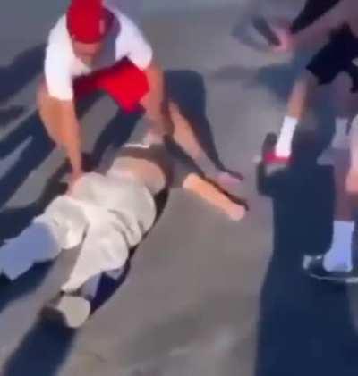 Dude gets knocked out by a car and then gets slapped