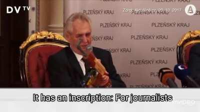 So Czech president has a gun with becherovka magazine for journalists...
