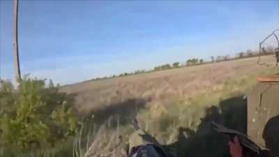 First-person footage of a Ukrainian soldier shooting down a Russian fiber-optic FPV quad before it could hit the truck he was riding in.