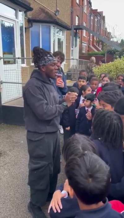 KSI visited & donated £25,000, giving presents and autographs to the children, and £6,000 to his ex-teachers, who returned it to the school