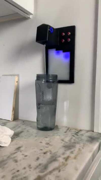 I built an automatic water dispenser to fill my water bottles to their exact dimensions without me having to stand there