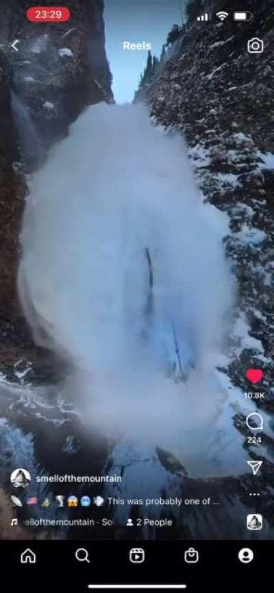 Ice climbing free solo with massive snow drift