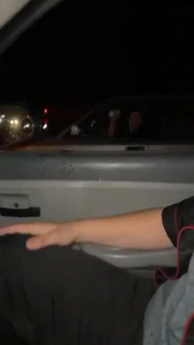 Throwing a drink at a car