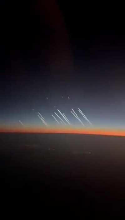Footage from a commercial aircraft's cockpit that shows ballistic missiles being launched