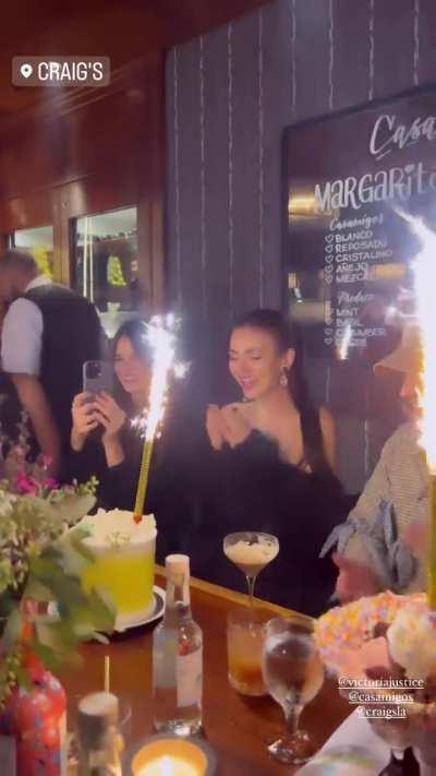 Receiving her birthday cake 2/22/2024