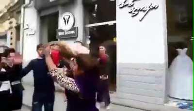 Woman uses her baby as a weapon during an altercation. Smdh.