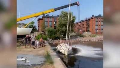 Crane falls on the shirtless guy’s new boat.