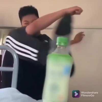 Kicking the cap of a bottle off