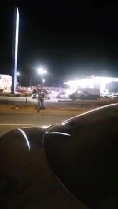 Guy getting hit by a car on a highway