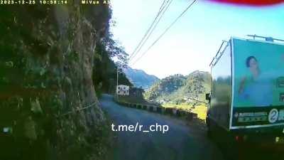 Xie Zhizhong's campaign advertising vehicle flipped over on a mountain road