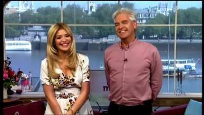 Holly Willoughby takes her high heels off.