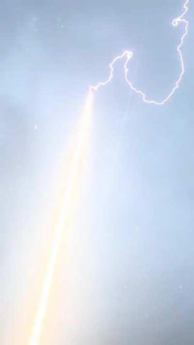 Lightning Bolt is guided to ground through a rocket trail