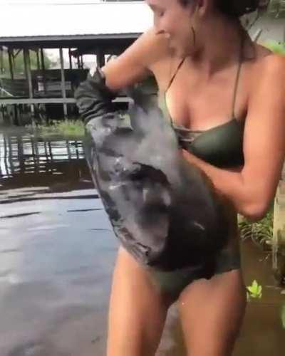 Girl catches a huge catfish