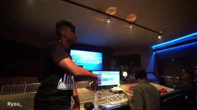 Does anyone know what song he recording here?