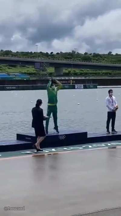 Brazilian Isaquias Queiroz celebrates his gold medal in canoeing with a Kamehameha