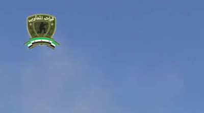 FSA fighters try their best to hit a low flying SyAAF plane using a DShK - Homs - 10/23/2013