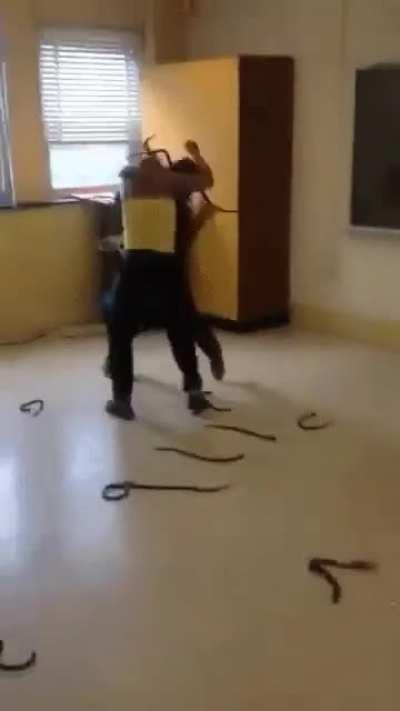 Two girls fight over and one starts to do the snake attack