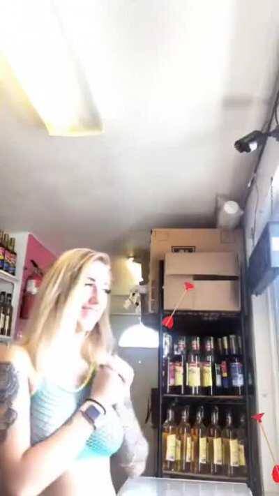 Bikini Barista flashing a customer