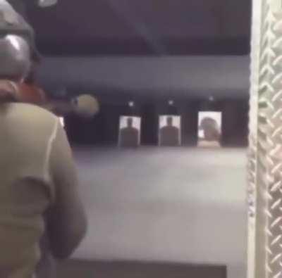 Idiot fires RPG-7 indoors, with a guy behind him