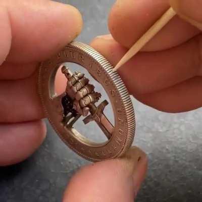 A modified US 1 Dollar Coin with a Hidden Button for Clasping and Unclasping a Sword