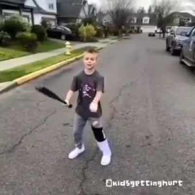 Kid hits himself in the head with baseball bat