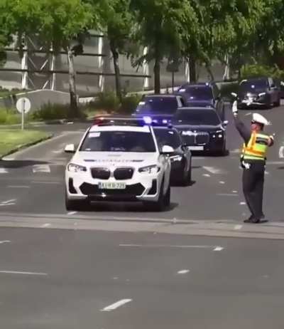 Hungary: A traffic policeman stops an ambulance to allow a convoy, apparently containing Slovakian Prime Minister Robert Fico, to pass, heading to a political rally organised by Prime Minister Viktor Orban. The video has angered many Hungarians.