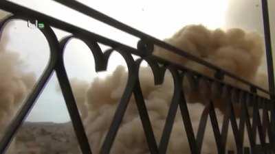 Syrian helicopter drops dumb bombs on top of the cameraman in Daraya - October 2015