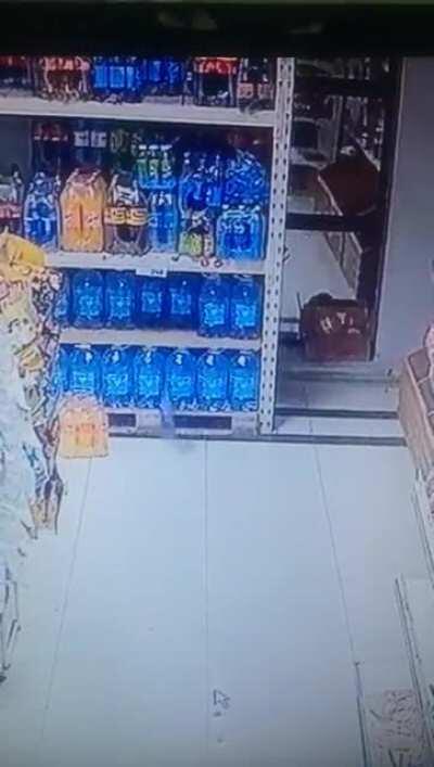 Bottle falls of the shelf but shoots itself back immediately