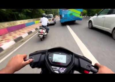 Stupid guy decided to race on Indian roads.