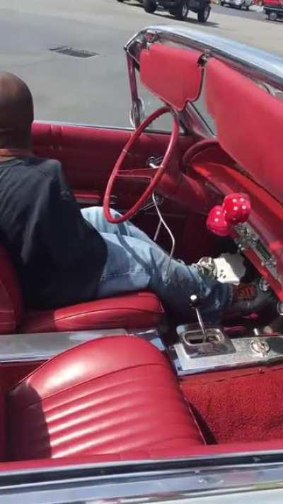 This armless driver navigating his specially-designed car with his feet.