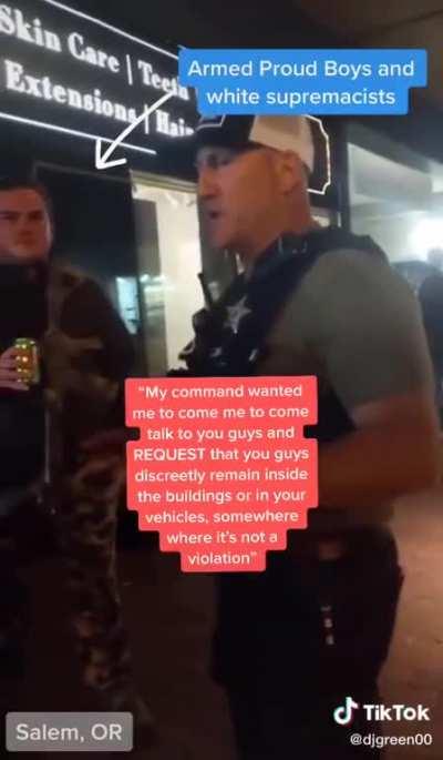 Police Officer Tells Proud Boys to Hide Inside Building Because They're About to Tear Gas Protesters. the Officer Said He Was Warning Them 