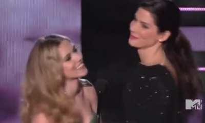Sandra Bullock and Scarlett Johansson kissing