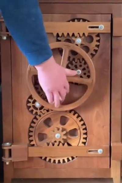 Solid walnut entertainment center with working gear doors.