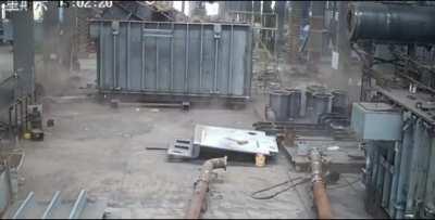 Man welding an electrical transformer filled with oil