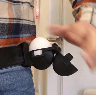I updated my tactical belt-mounted egg holster to feature a latch. Now you can safely perform a handstand while keeping your egg safe.