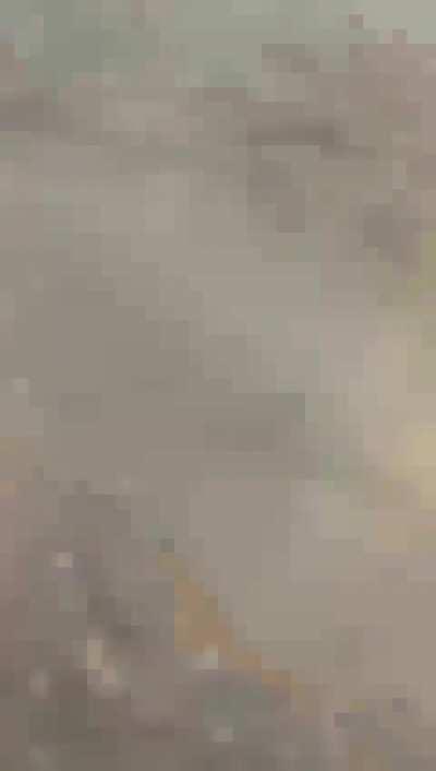 Man runs away from Hamas fighters in southern Israel, 7 Oct 2023