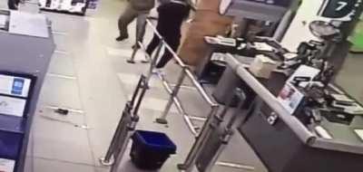 Agressive guy gets taken out by security guard.