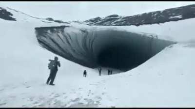 Visitor ignores warning sign about falling ice. Last warning he ignored.