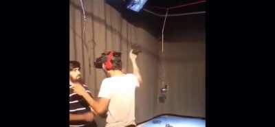 Standing beside someone playing VR