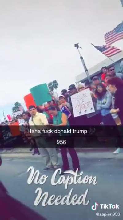 Blasting “Fuck Donald Trump” in a trump parade