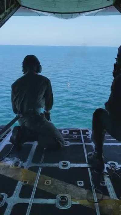[Loud?] USCG HC-130H dropping a message block. Y'all really seemed to enjoy the view from the boat yesterday, so heres the view from the plane today.