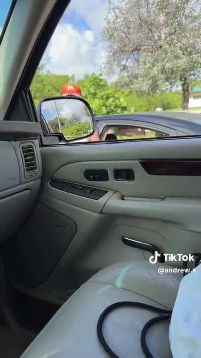 Woman gets out of her car to argue, gets pinned by her own car