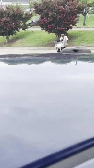 one legged guy at foodcity nodding out and doing donuts on a rascal