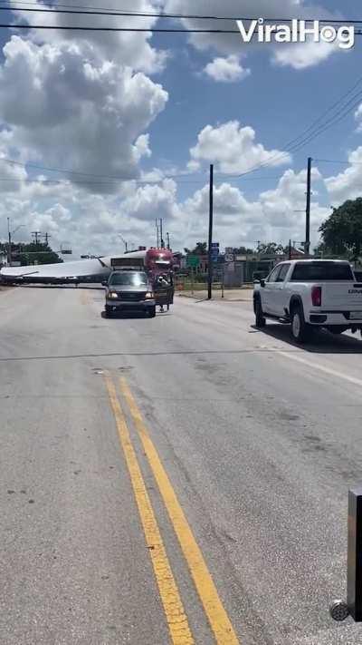 Train Cuts Through Wind Blade at Crossing
