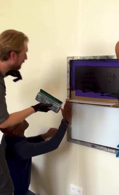 Apply signage on a museum wall