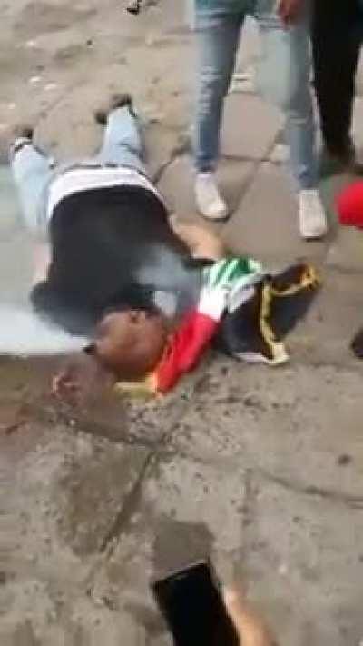 Complete footage the Iraqi protestor who got his skull crushed with tear gas canister and smokes inside his head (Warning VERY NSFW)