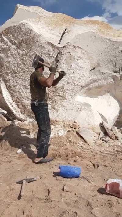 This is how they used to break stone before machinery