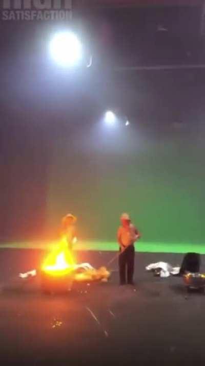 Throwing molten iron against cold bricks to create showers of sparks, at the Da Shuhua (Chinese Festival of Lights) in Nuanquan Town, Zhangjiakou.