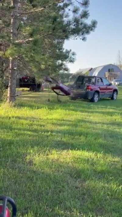 WCGW attempting to pull down a tree