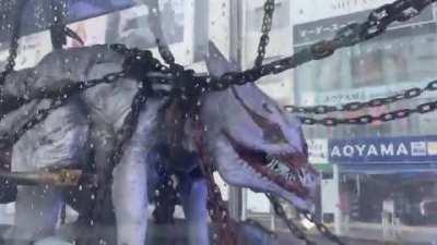 On the streets of Tokyo, they noticed a transport with a monster in a transparent cage. As it turned out, this is an advertisement for the film 